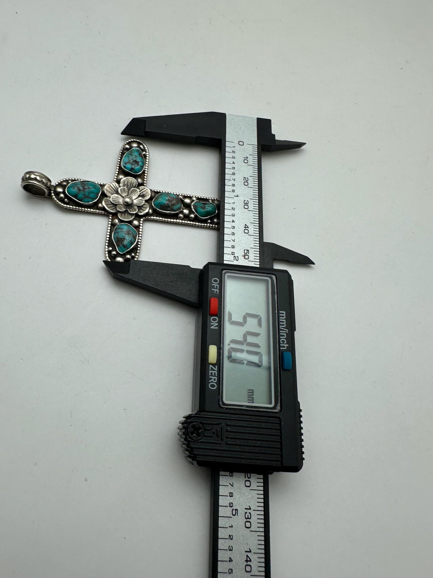 Handcrafted Tibetan Repousse Silver Cross Pendant with Turquoise, Floral Design