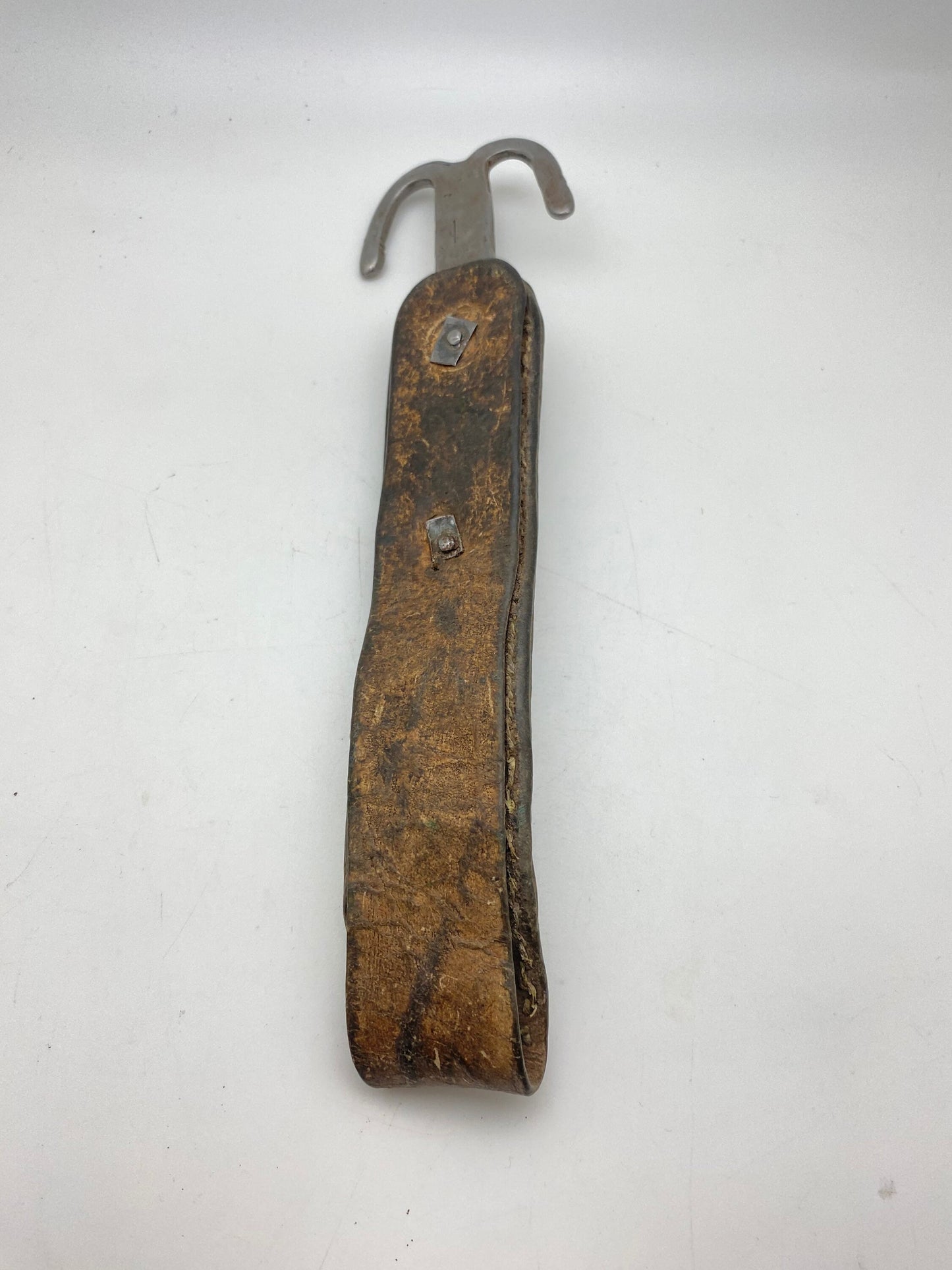 Early 20th century Tibetan ornament, leather with white metal and old glass, Tibet