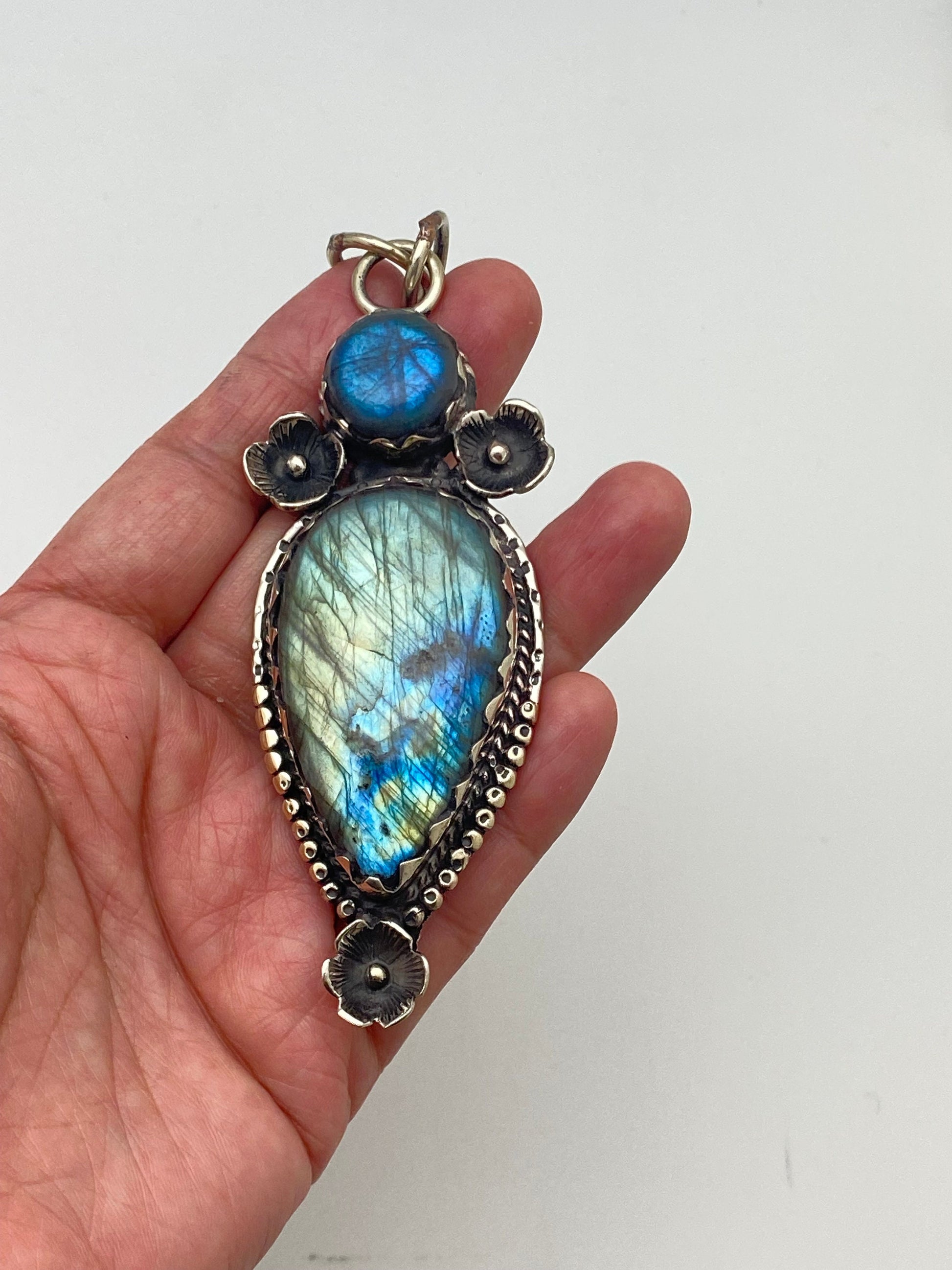 Handcrafted Labradorite Pendant: Tibetan Silver Floral Design