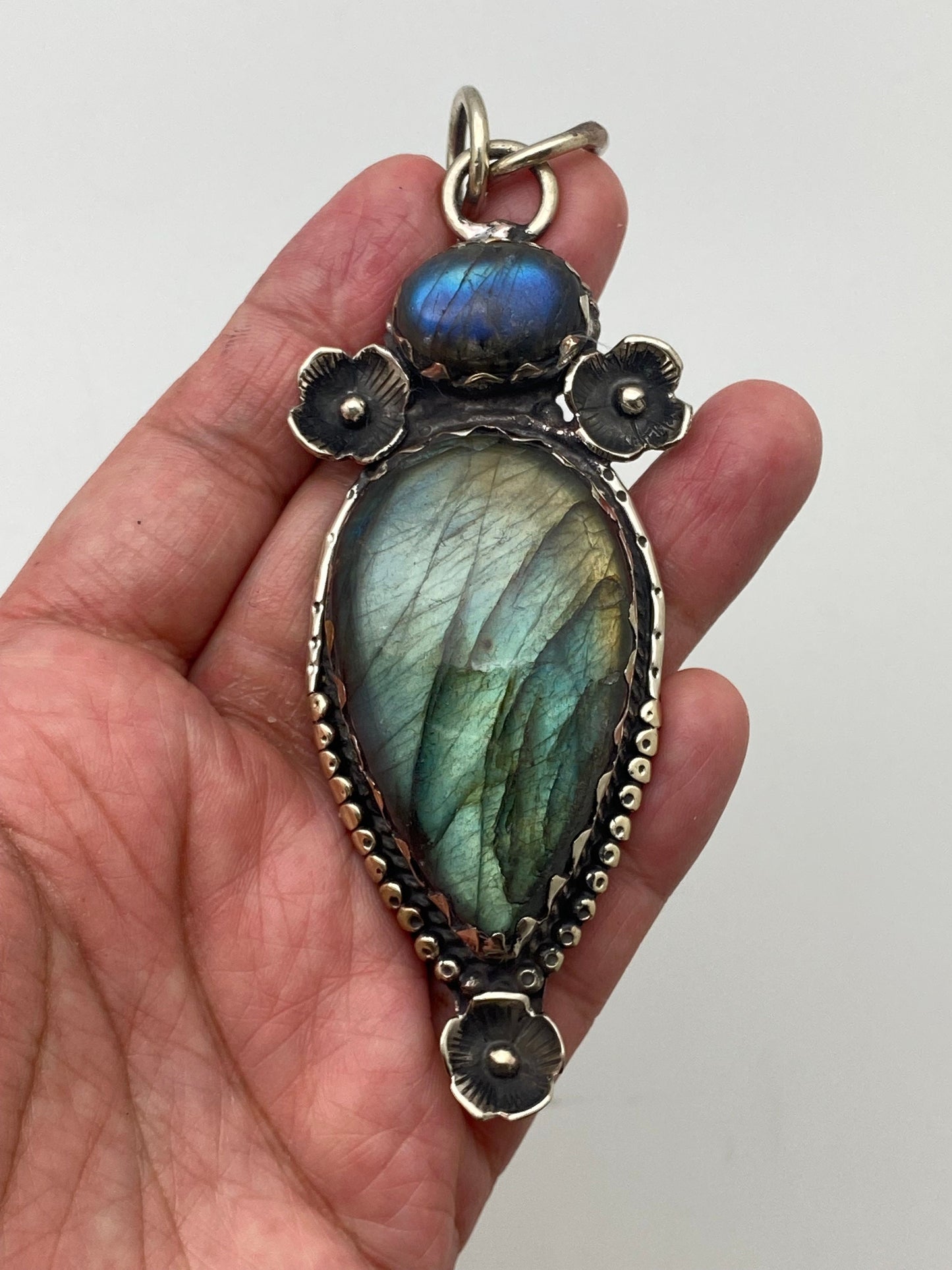 Handcrafted Labradorite Pendant: Tibetan Silver Floral Design