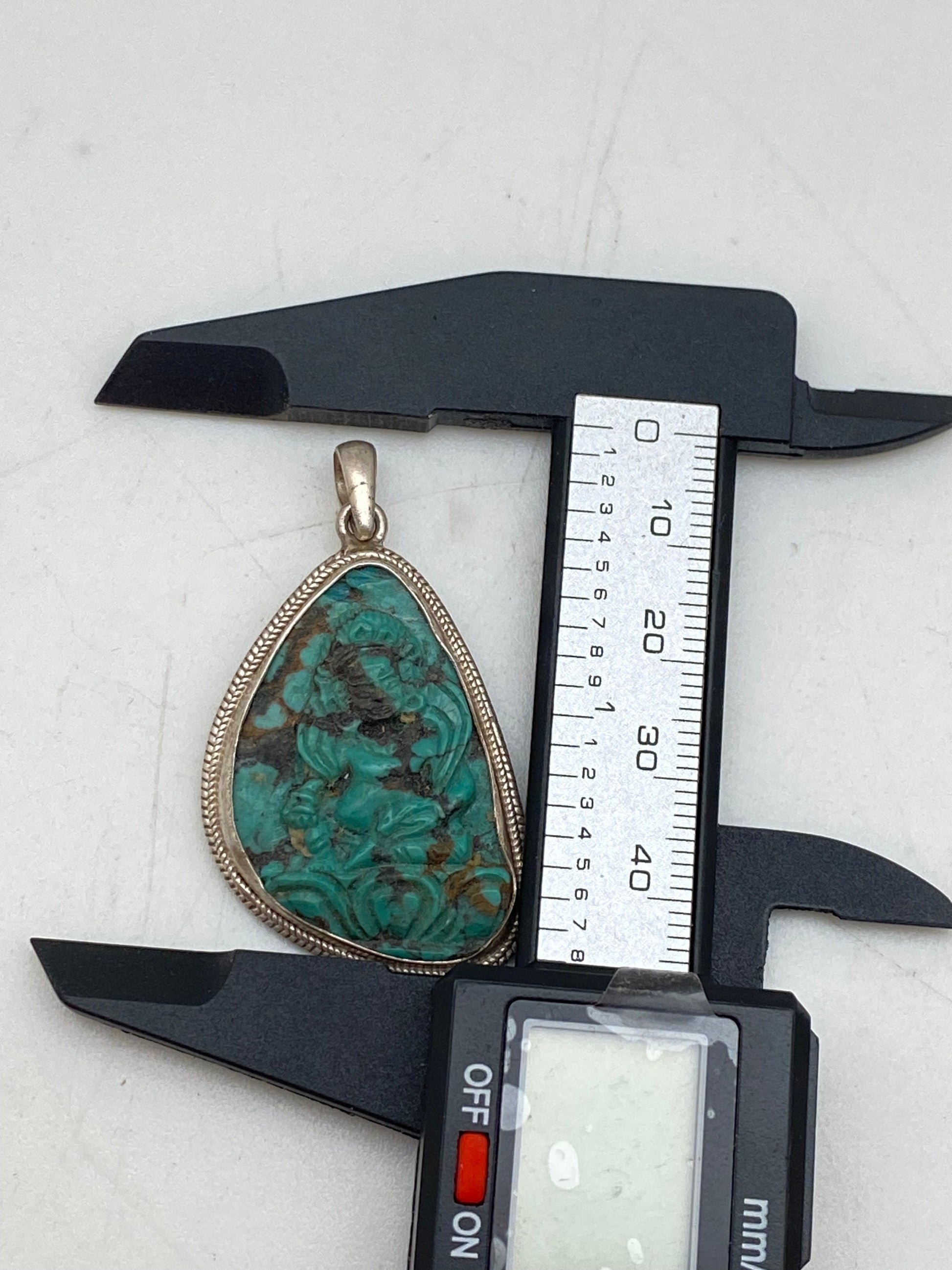 Handcrafted Turquoise Zambala Pendant: Sterling Silver Tibetan Amulet
