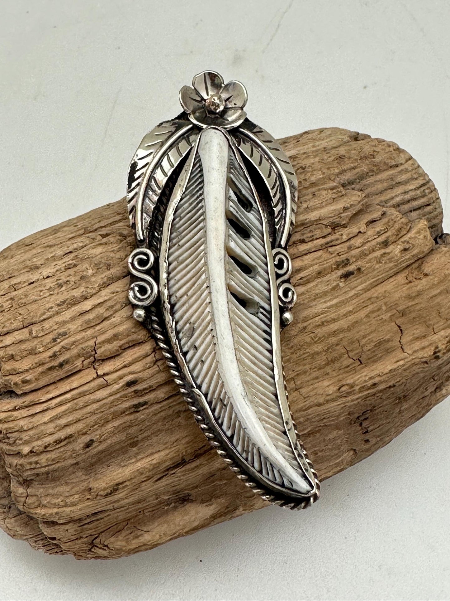 Handcrafted Bone Feather Pendant: Coin Silver Floral Design