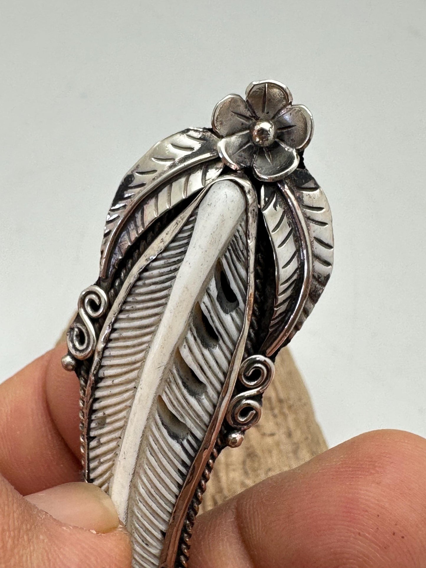 Handcrafted Bone Feather Pendant: Coin Silver Floral Design