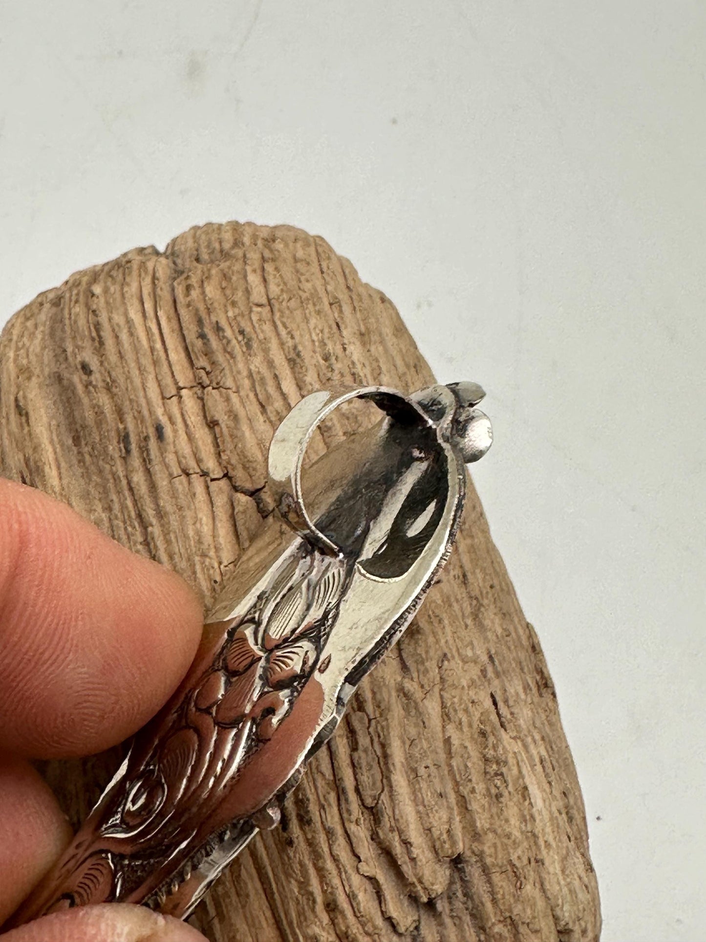 Handcrafted Bone Feather Pendant: Coin Silver Floral Design