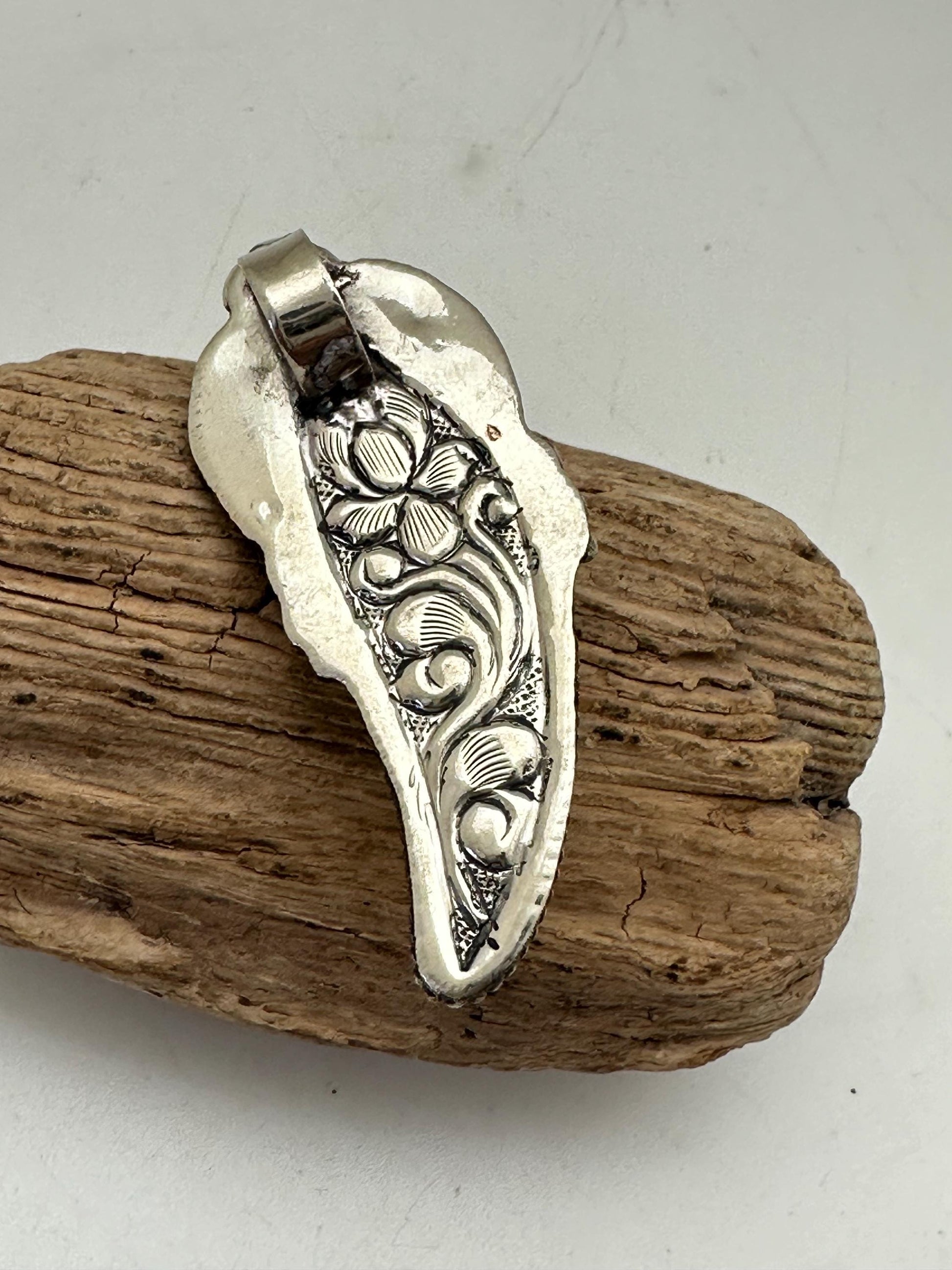Handcrafted Bone Feather Pendant: Coin Silver Floral Design