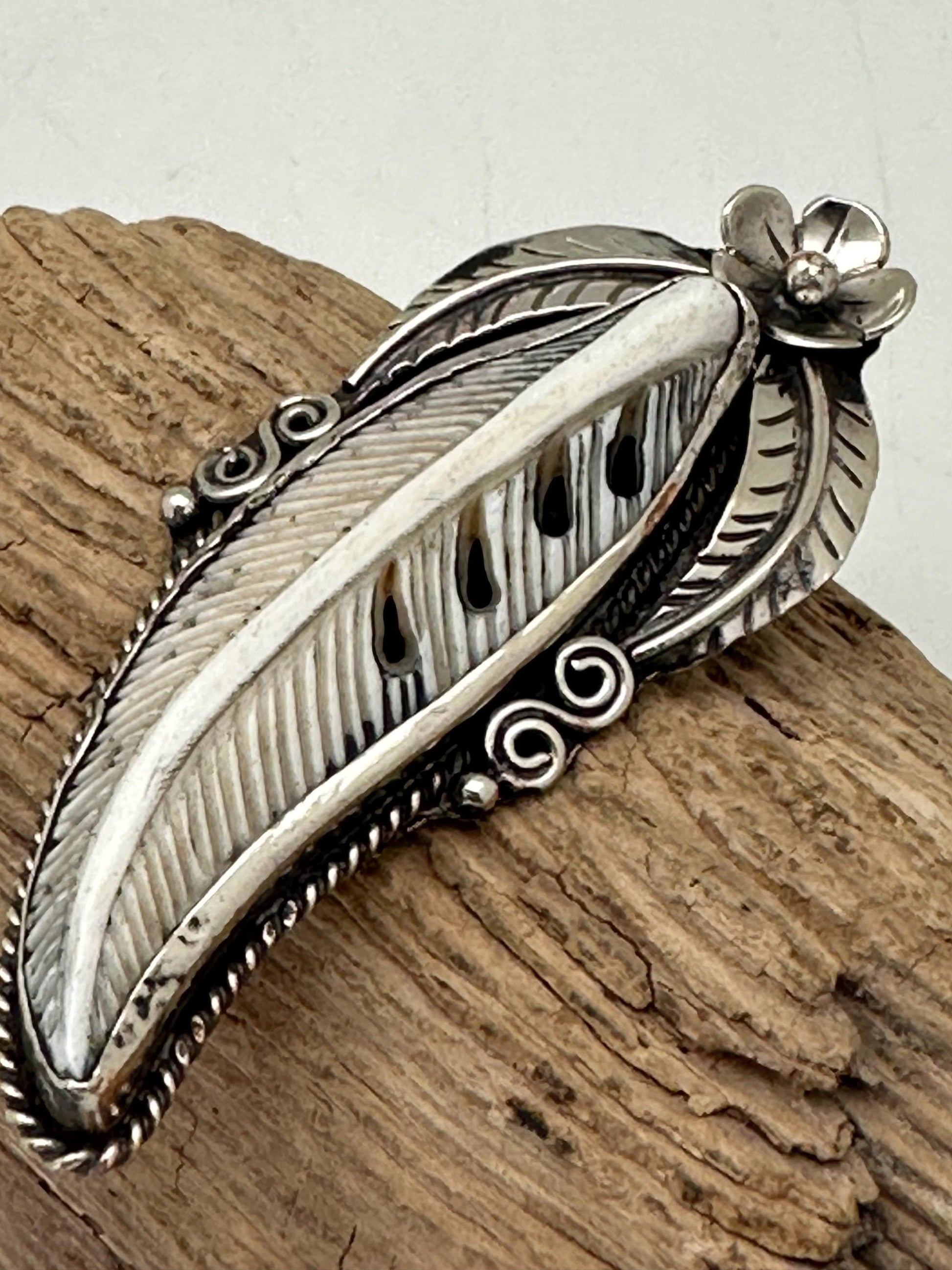 Handcrafted Bone Feather Pendant: Coin Silver Floral Design