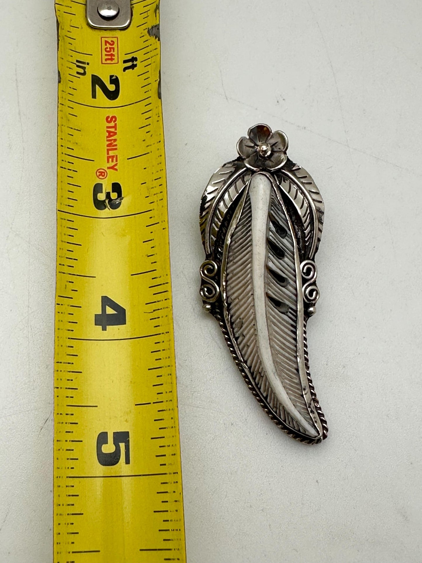 Handcrafted Bone Feather Pendant: Coin Silver Floral Design