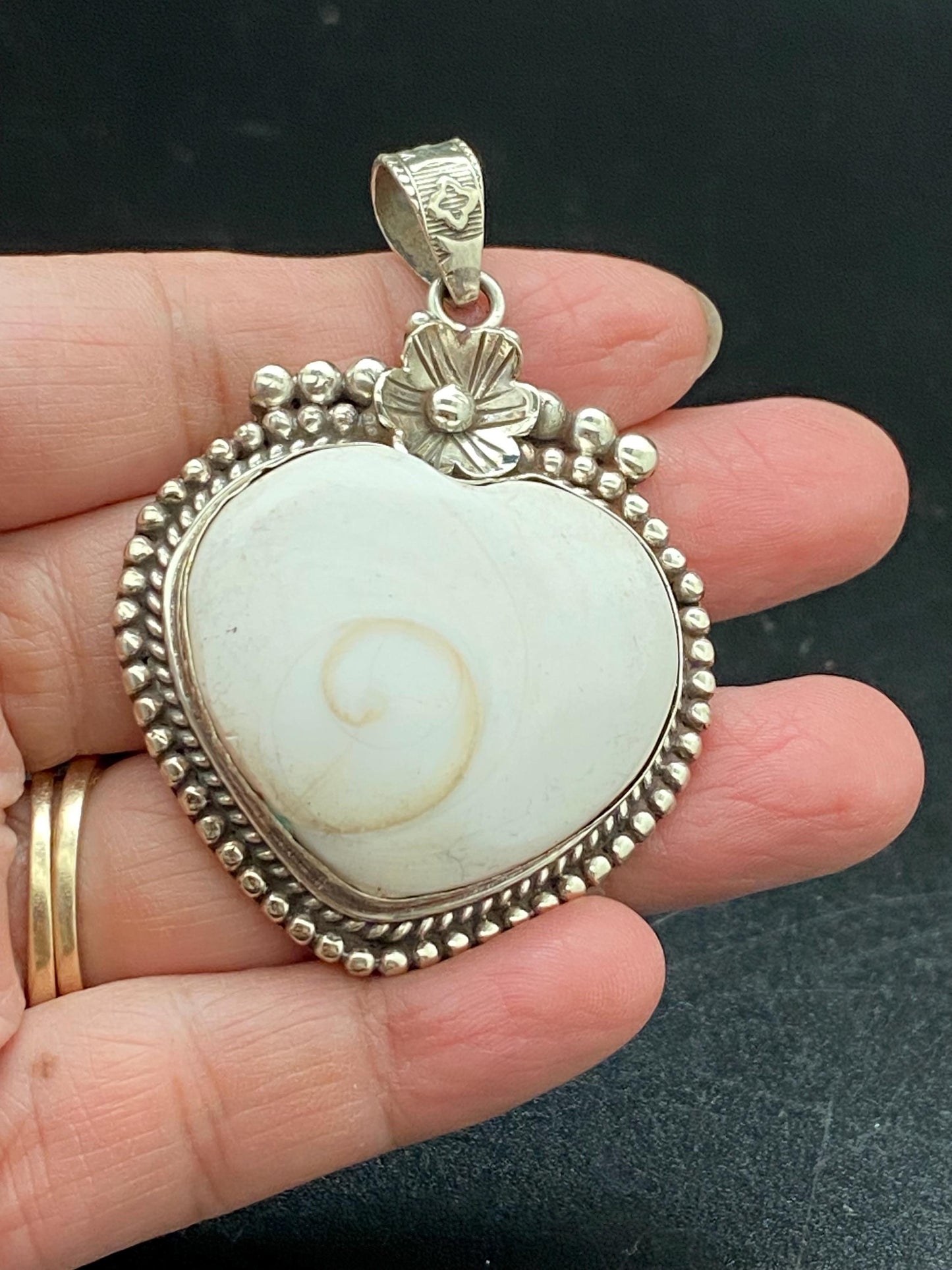 Handcrafted Shiva Shell Heart Pendant: Tibetan Silver Floral Design