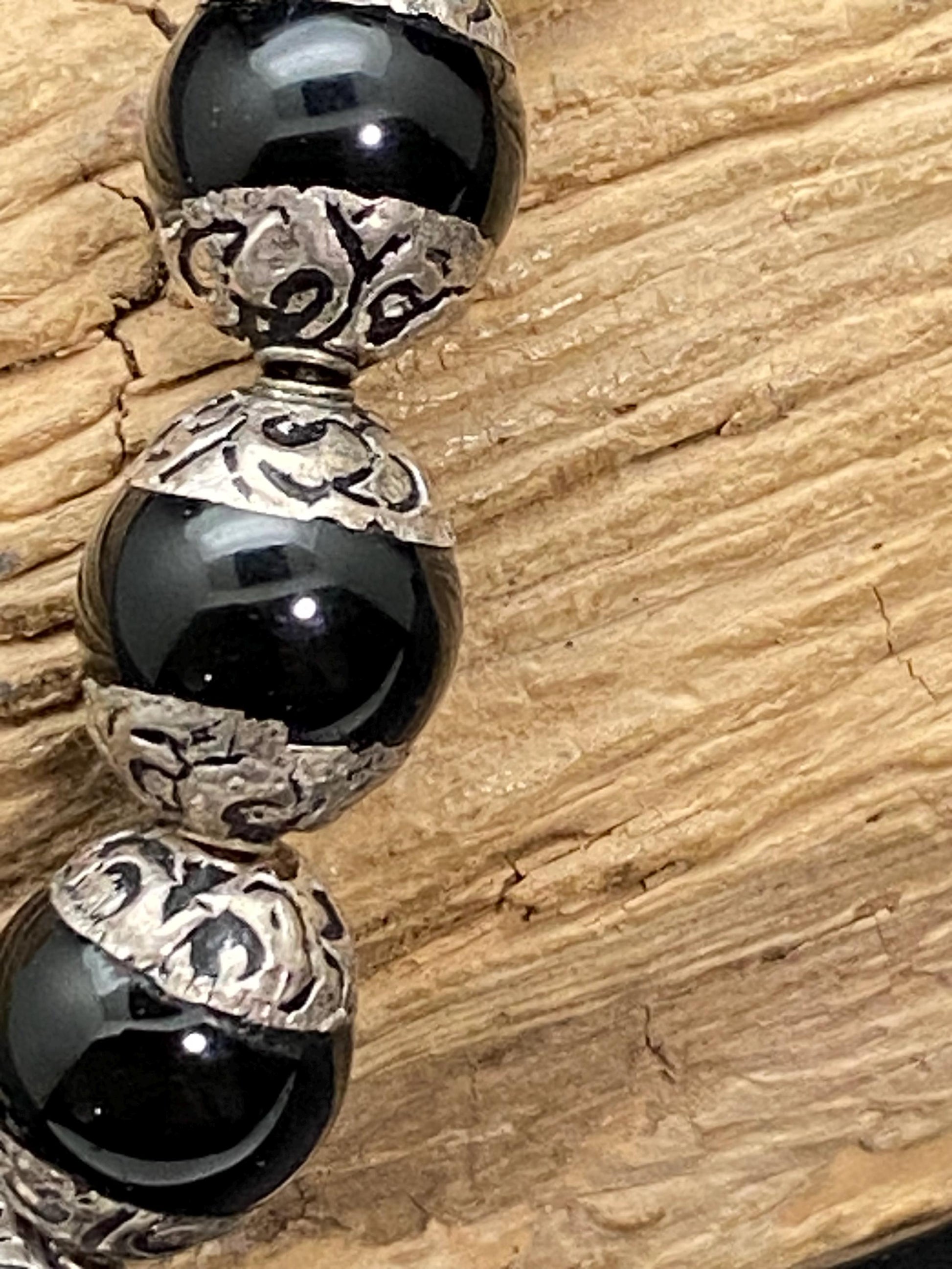 Handcrafted Black Onyx Mala Necklace: Tibetan Silver Capped Beads