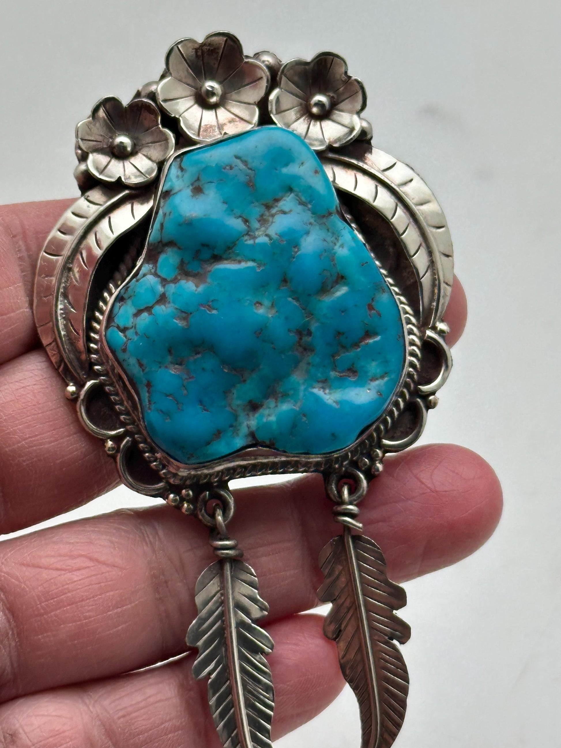 Handcrafted Turquoise Tibetan Silver Pendant: Ethnic Floral Dangle