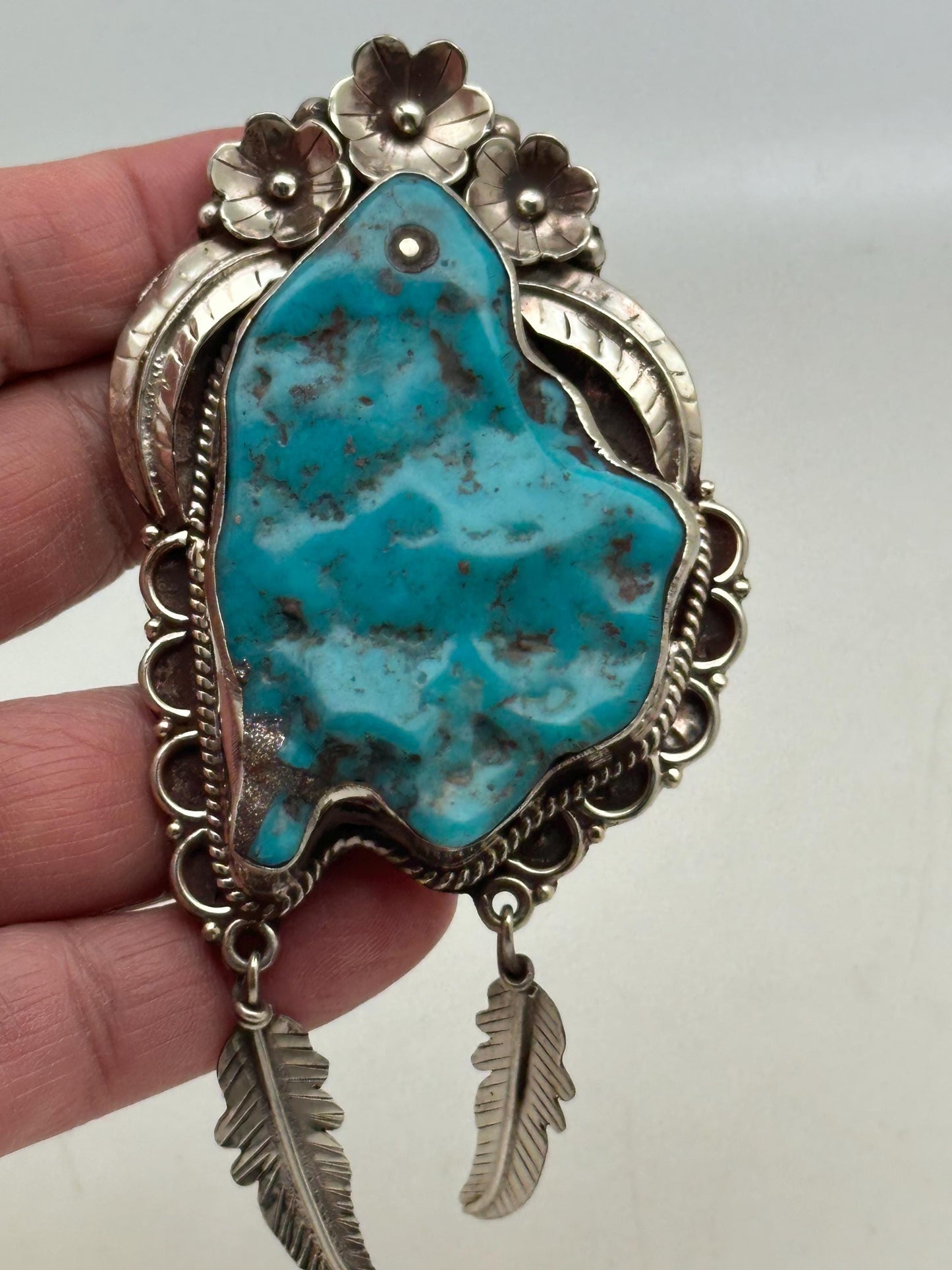 Handcrafted Turquoise Tibetan Silver Pendant: Ethnic Floral Dangle
