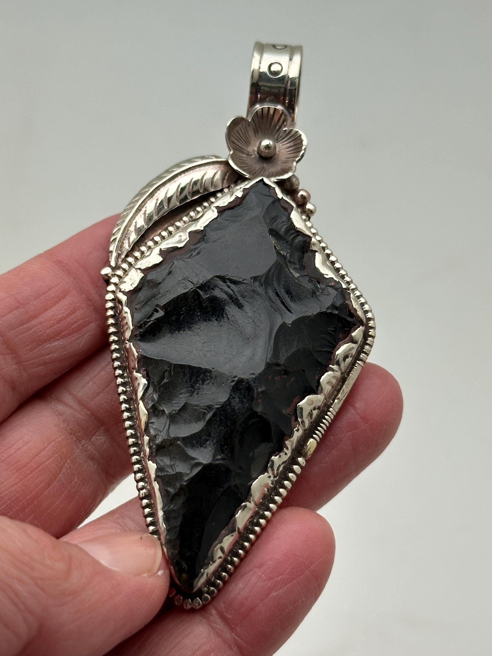 Obsidian Arrowhead pendant, handcrafted, Tibetan silver, floral design, Himalayan, Nepalese
