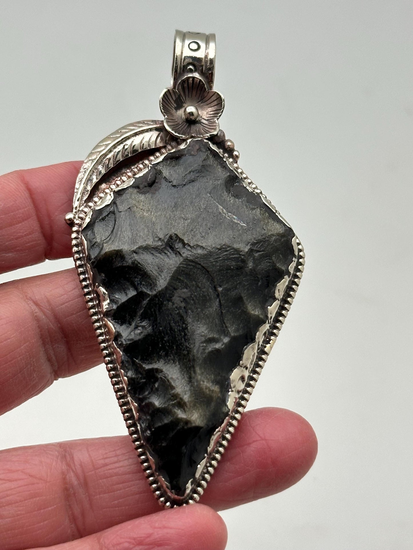 Obsidian Arrowhead pendant, handcrafted, Tibetan silver, floral design, Himalayan, Nepalese