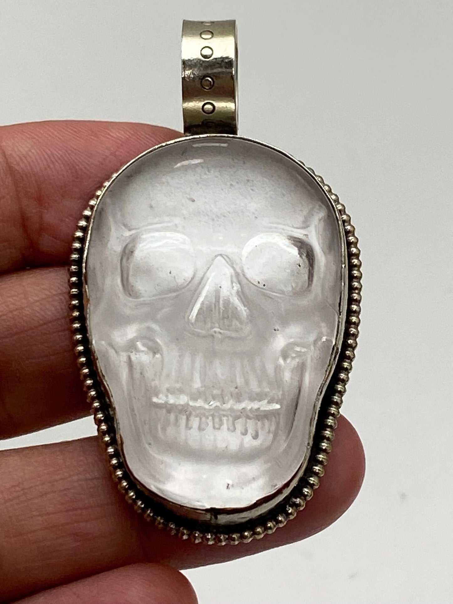 Quartz crystal carved skull pendant, handcrafted, Tibetan silver, Nepalese