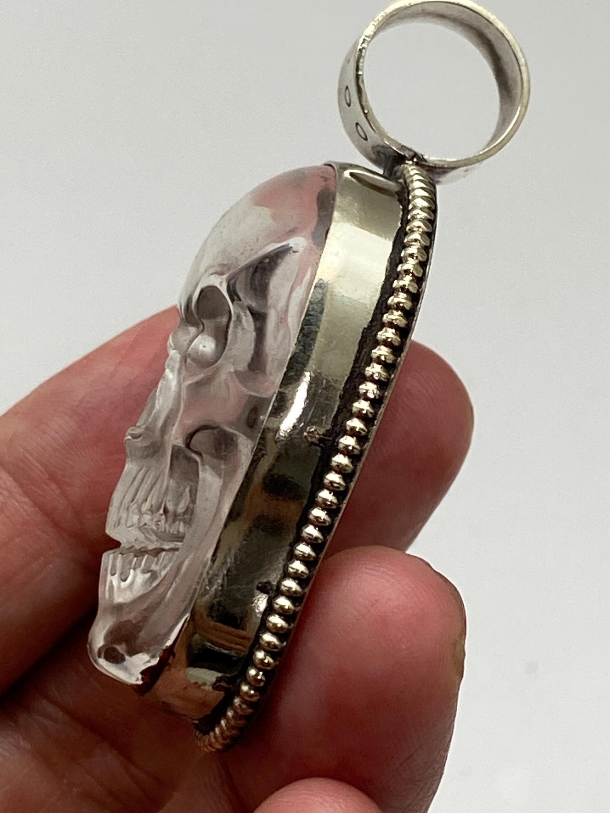 Quartz crystal carved skull pendant, handcrafted, Tibetan silver, Nepalese