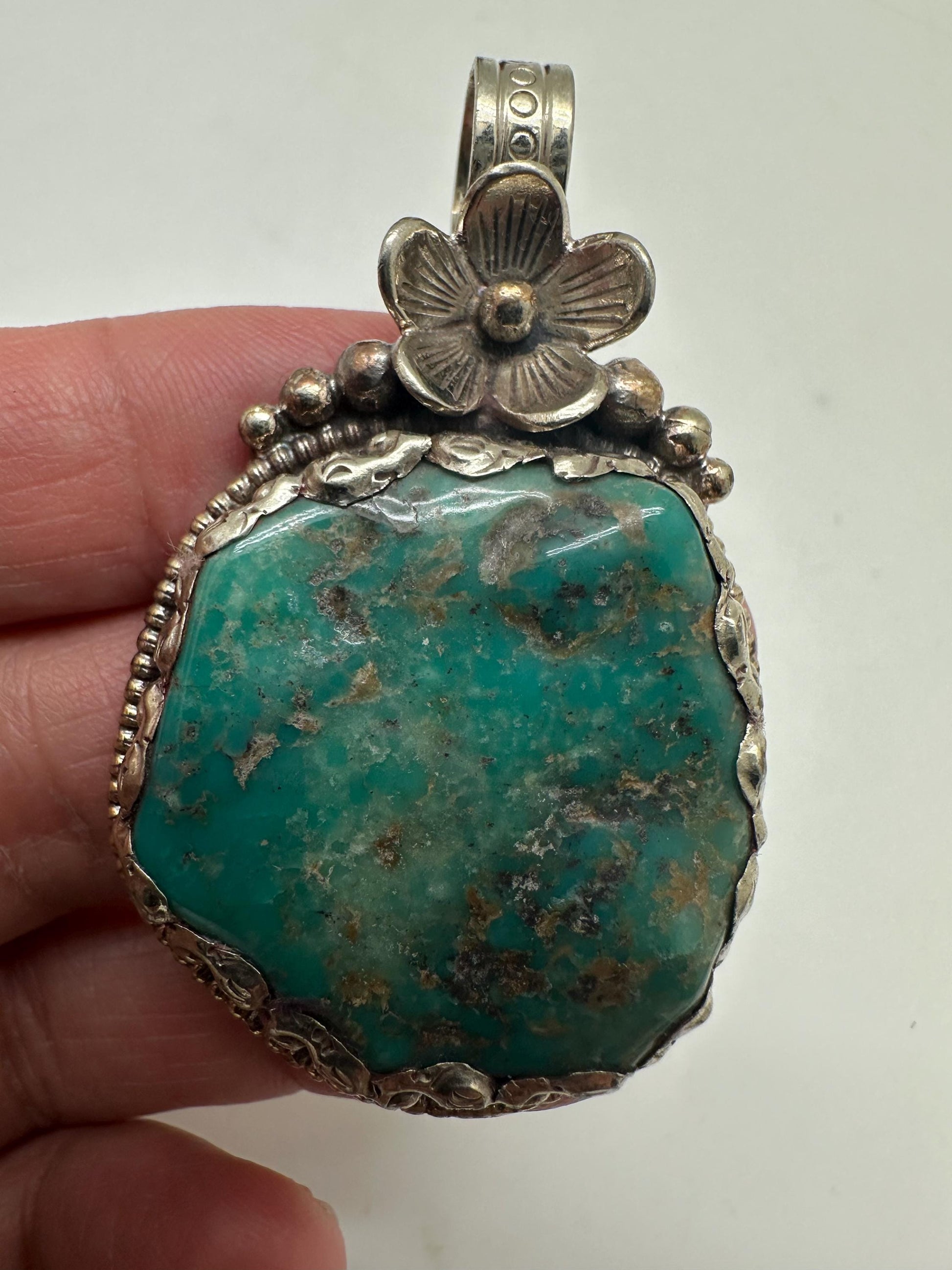 Turquoise pendant, handcrafted,Tibetan reposse silver, floral design, ethnic style