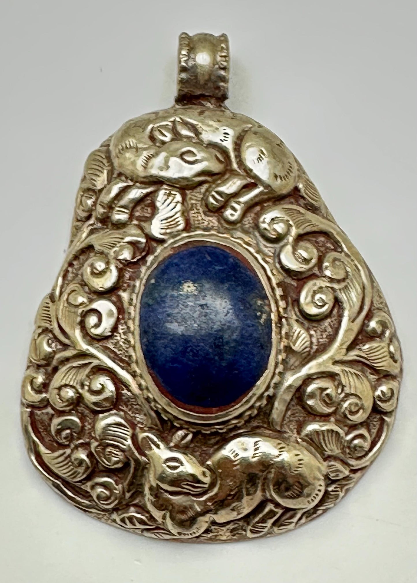 Lapis Lazuli Pendant, Handcrafted Tibetan Repoussé Silver, Animal Motif Jewelry