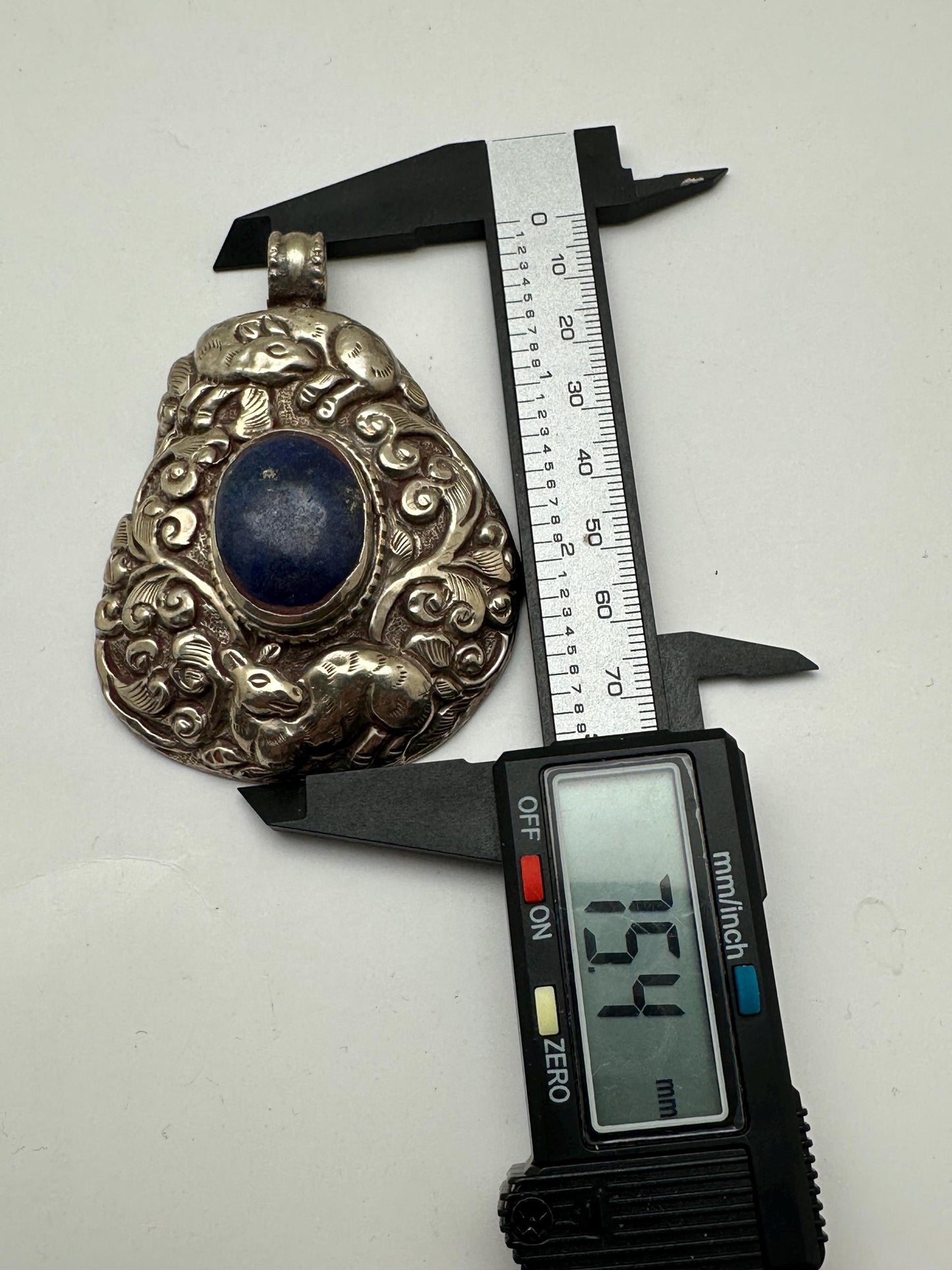 Lapis Lazuli Pendant, Handcrafted Tibetan Repoussé Silver, Animal Motif Jewelry