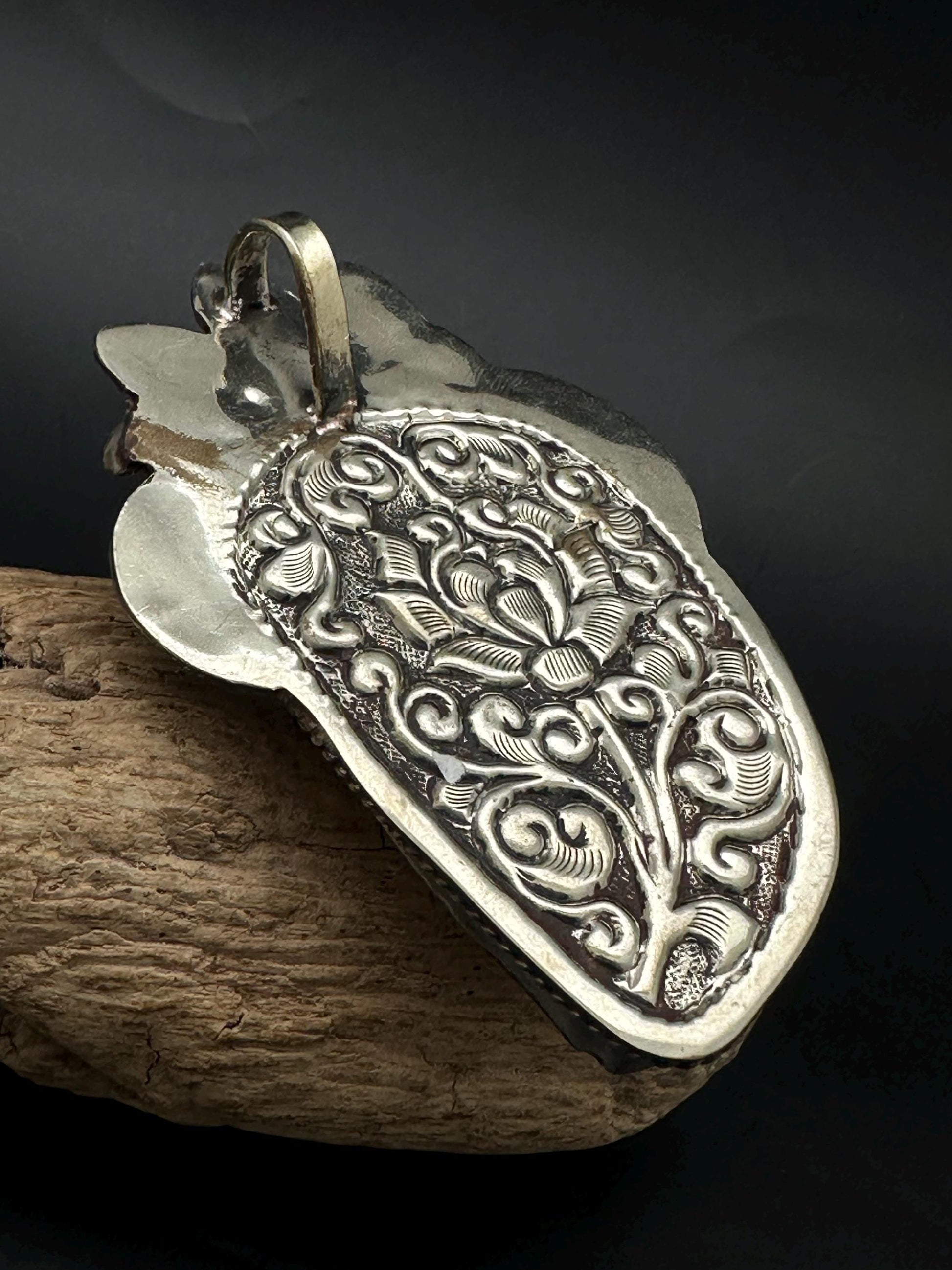 Bone skull with bear pendent, set with Tibetan silver