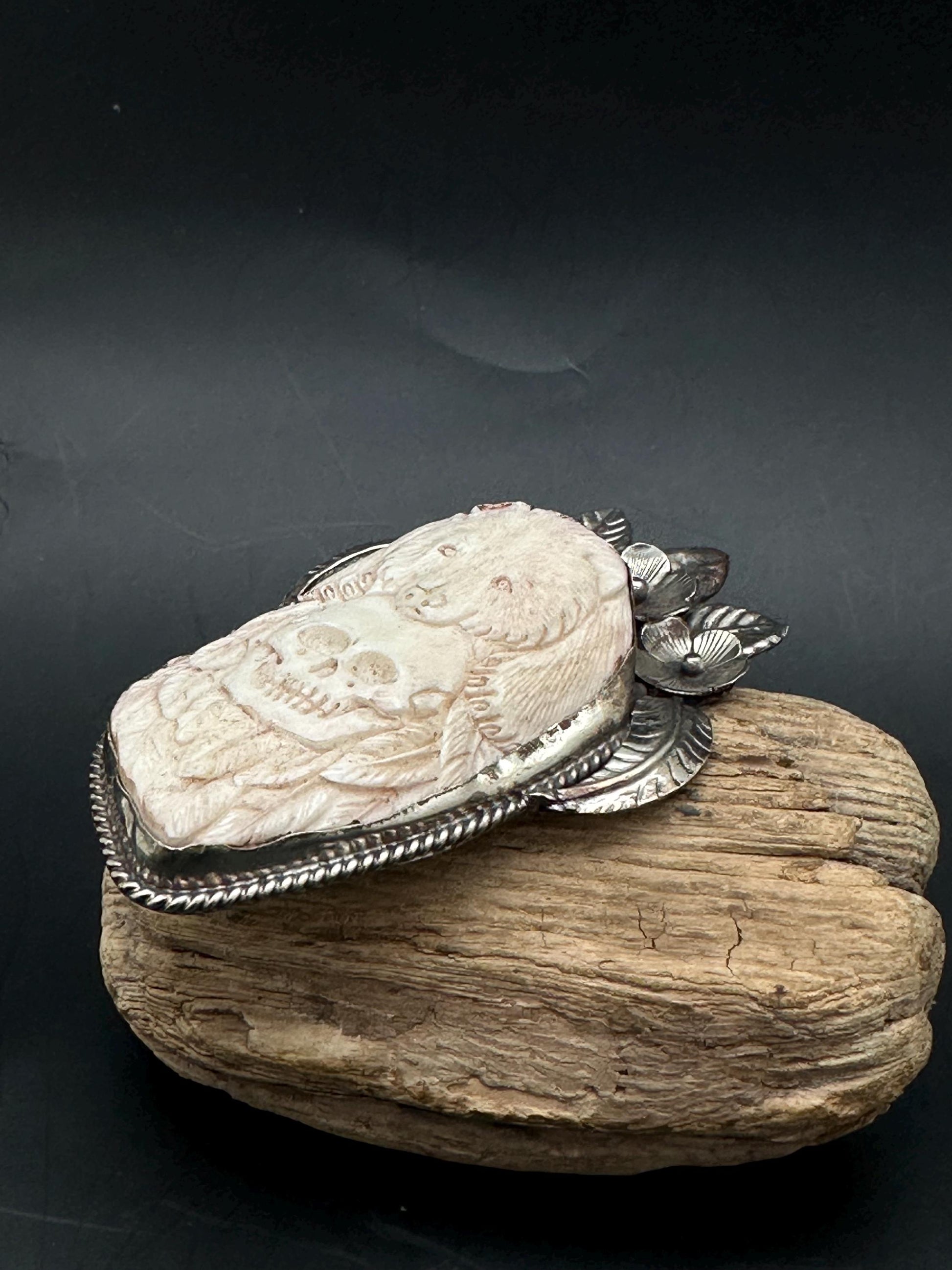 Bone skull with bear pendent, set with Tibetan silver