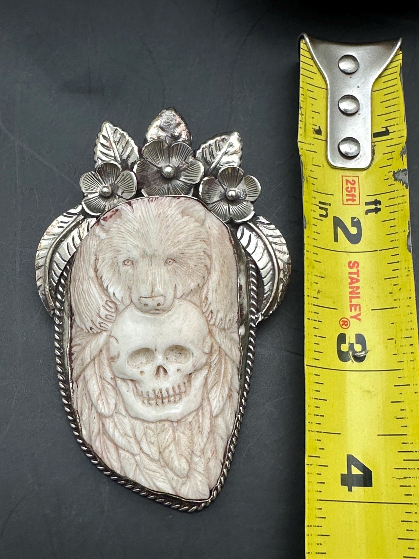 Bone skull with bear pendent, set with Tibetan silver