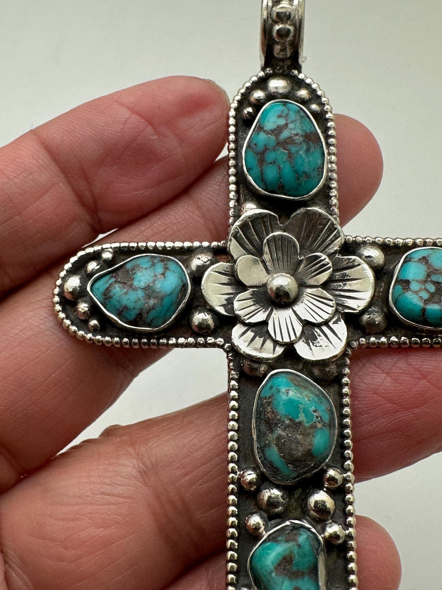 Handcrafted Tibetan Repousse Silver Cross Pendant with Turquoise, Floral Design