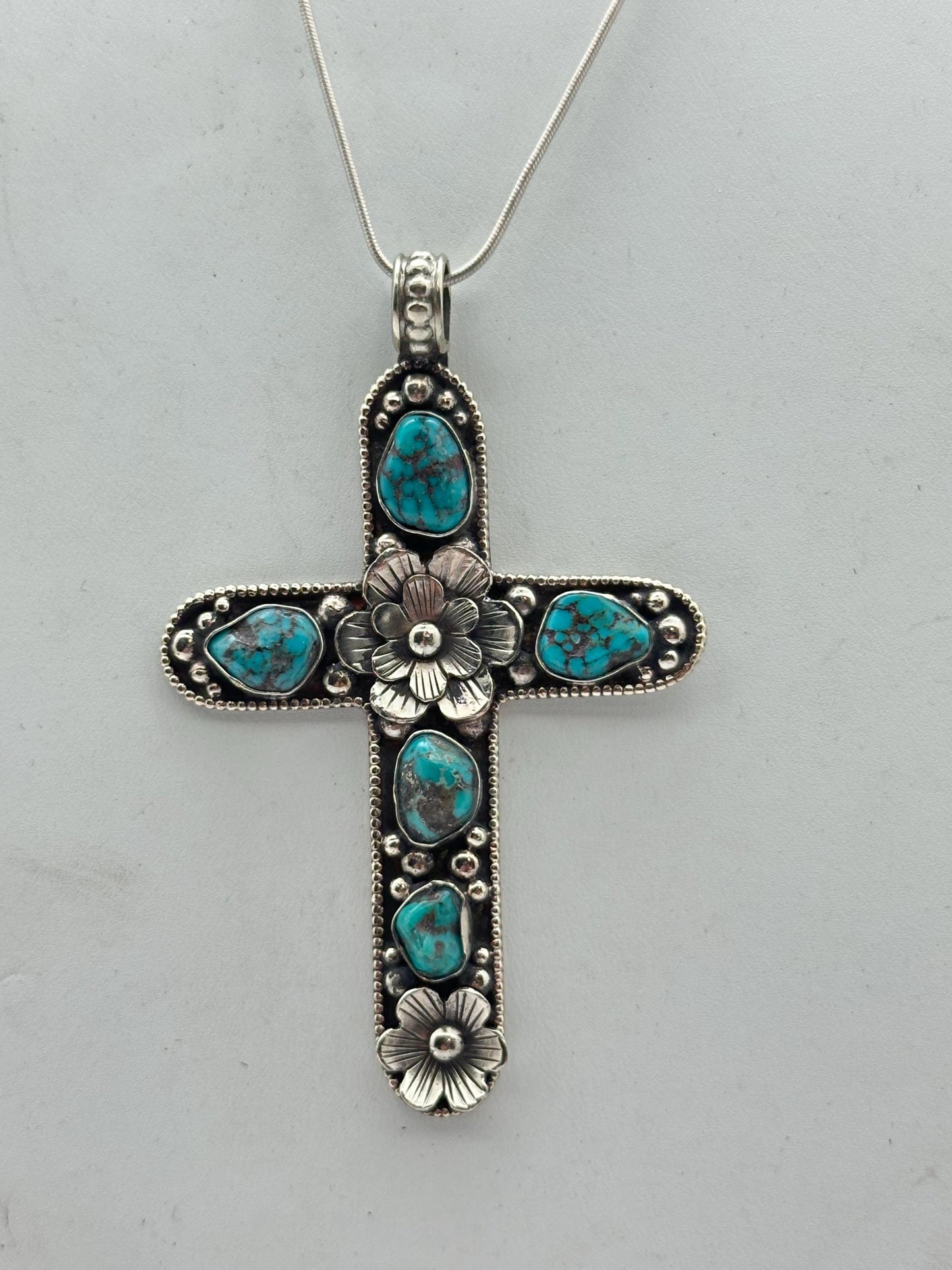 Handcrafted Tibetan Repousse Silver Cross Pendant with Turquoise, Floral Design