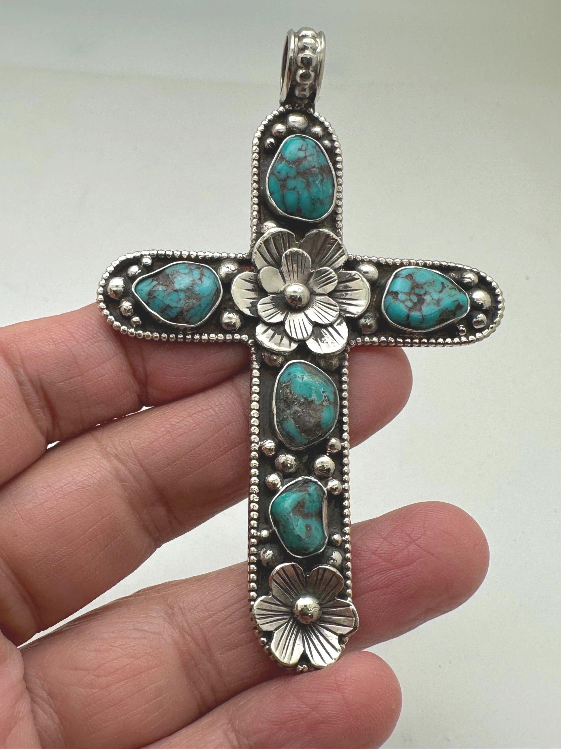 Handcrafted Tibetan Repousse Silver Cross Pendant with Turquoise, Floral Design