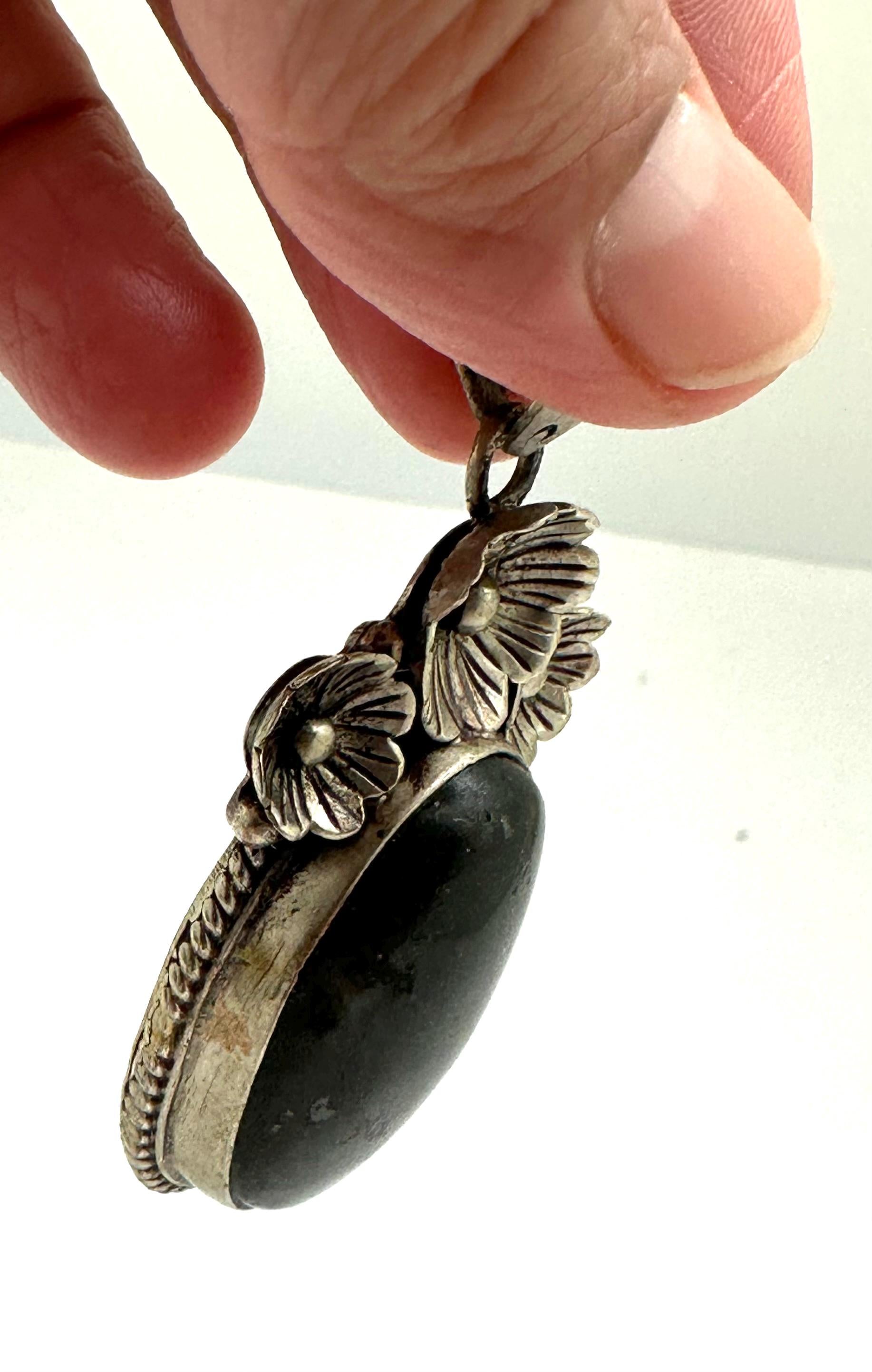 Labradorite pendant, handcrafted,tibetan repousse silver, floral design ,ethnic style,59mmX26mm