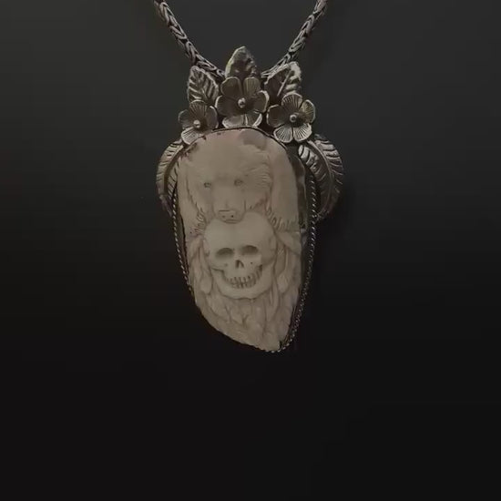 Bone skull with bear pendent, set with Tibetan silver