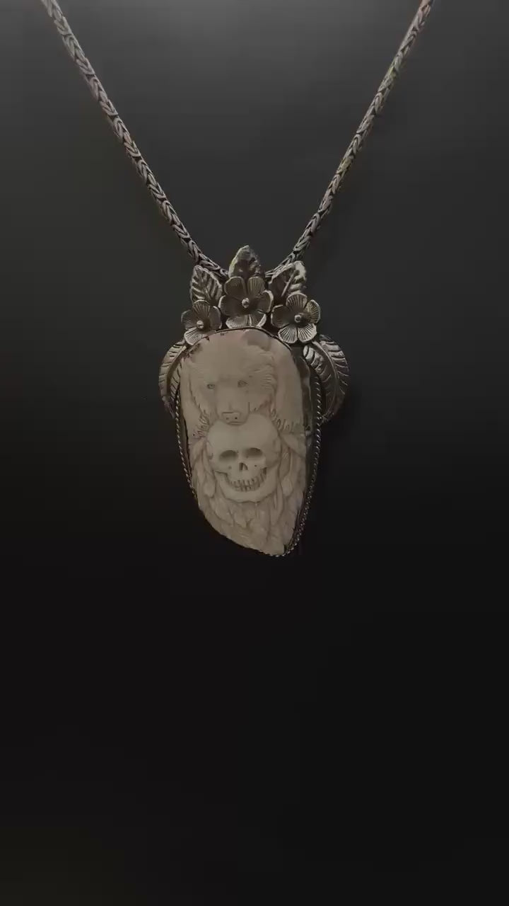 Bone skull with bear pendent, set with Tibetan silver